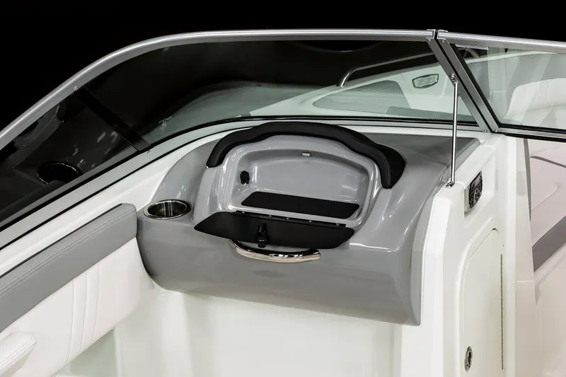 Slide: The Image of Manufacturer Provided Image: 2023 Chaparral 23 SSi boat dashboard with glove compartment and cup holder. - 5