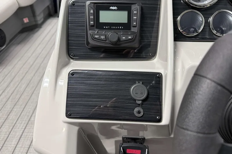 Slide: The Image of Dashboard of 2026 Sylvan Mirage 8520 LZ PTS Tritoon with audio controls and gauges. - 11