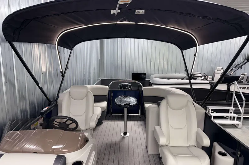Slide: The Image of 2026 Sylvan Mirage 8520 LZ PTS Tritoon interior with canopy and seating. - 24