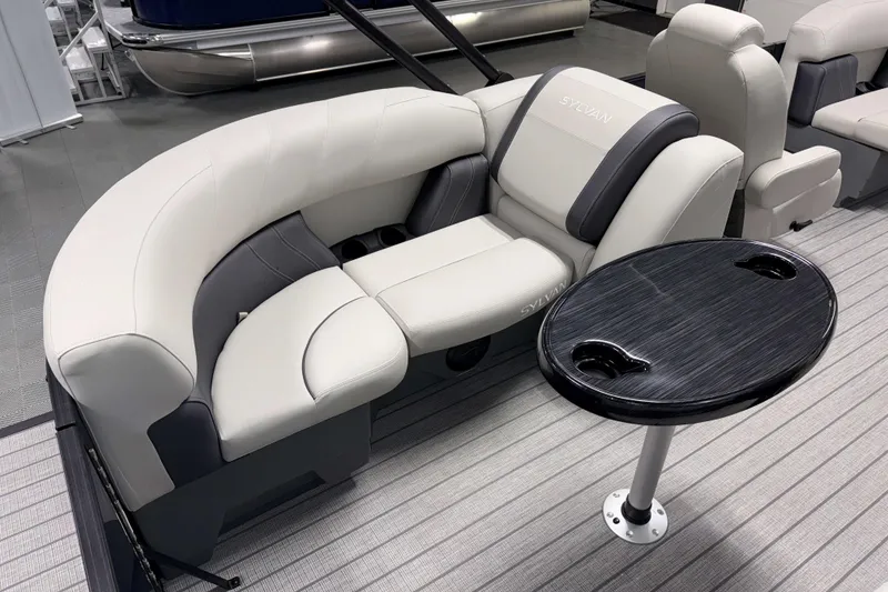 Slide: The Image of Luxurious seating on 2026 Sylvan Mirage 8520 LZ PTS Tritoon with sleek table design. - 4