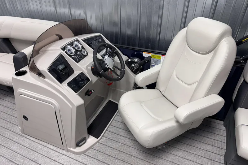 Slide: The Image of Captain's chair and helm of 2026 Sylvan Mirage 8520 LZ PTS Tritoon boat. - 5