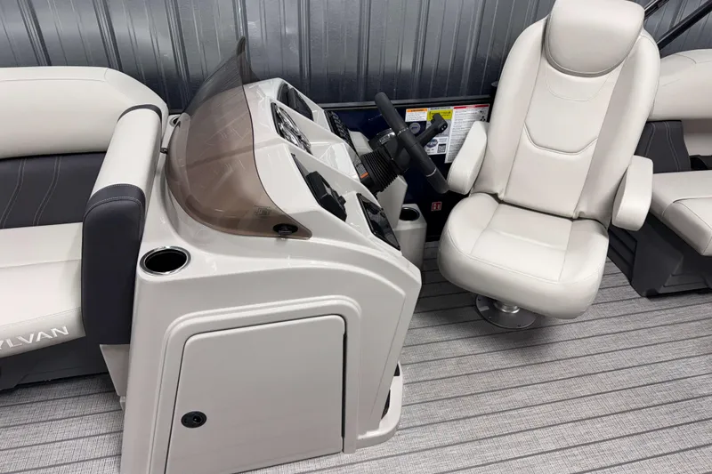 Slide: The Image of Luxurious interior of 2026 Sylvan Mirage 8520 LZ PTS Tritoon with plush seating and modern helm. - 6