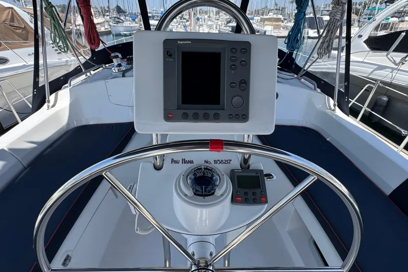 Slide: The Image of Steering wheel and navigation equipment on a 2004 Hunter 41 Aft Cockpit sailboat. - 11