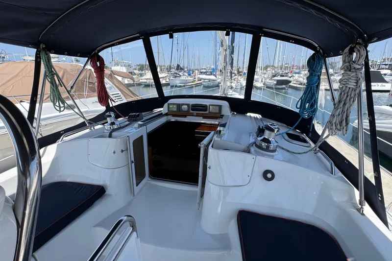 Slide: The Image of 2004 Hunter 41 Aft Cockpit sailboat interior with marina view. - 13