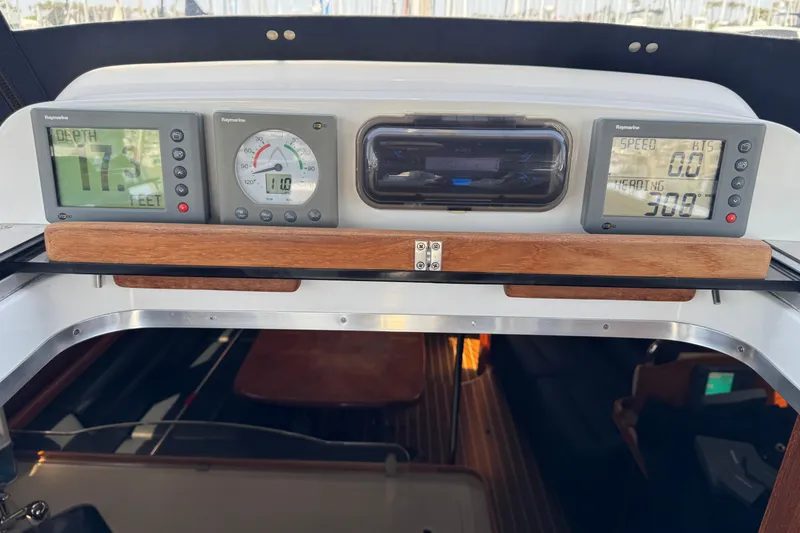 Slide: The Image of Control panel of a 2004 Hunter 41 Aft Cockpit sailboat with navigation instruments. - 14