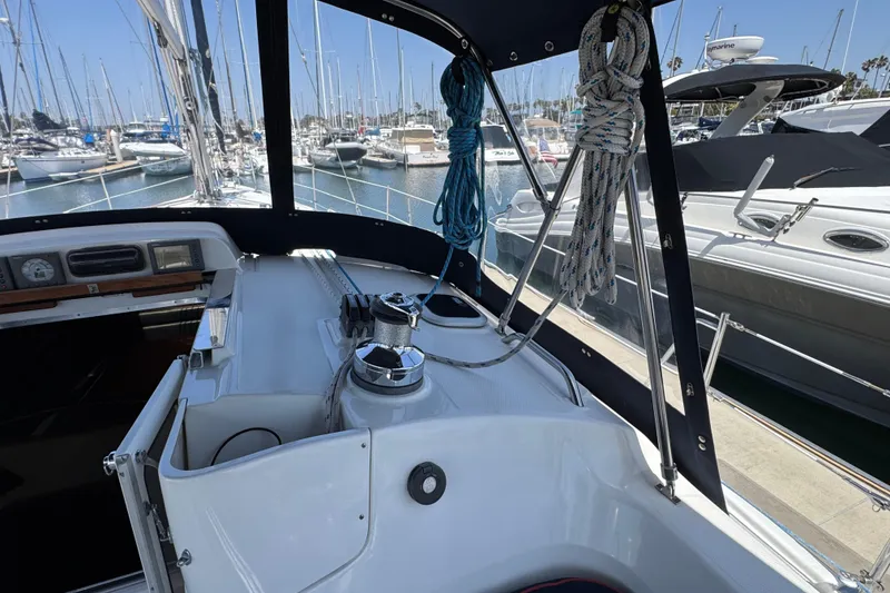 Slide: The Image of Hunter 41 Aft Cockpit 2004 sailboat interior with ropes and marina view. - 15
