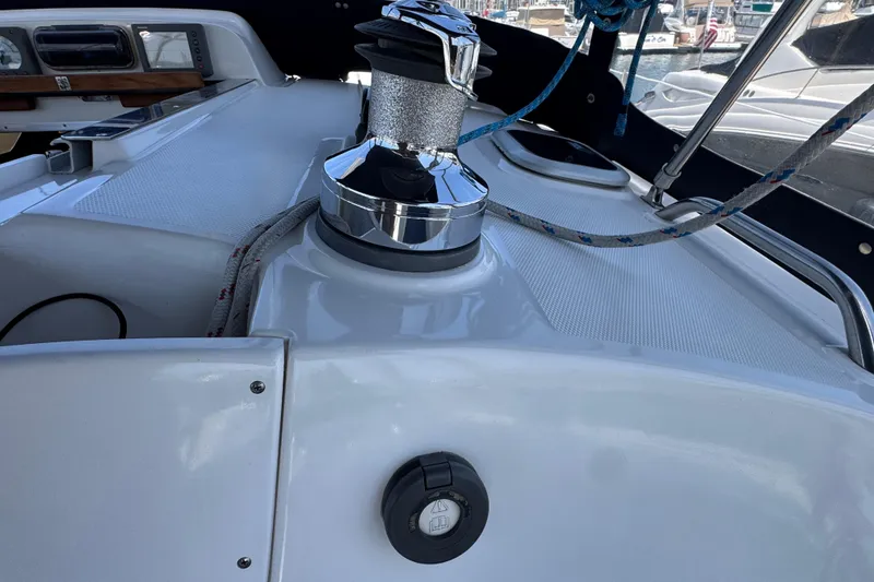 Slide: The Image of 2004 Hunter 41 Aft Cockpit sailboat deck with winch and ropes. - 18