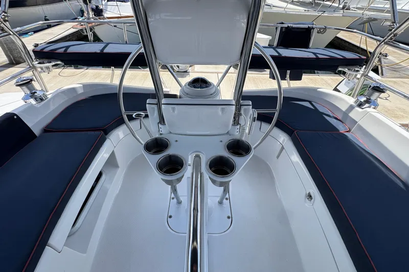 Slide: The Image of 2004 Hunter 41 Aft Cockpit sailboat with spacious seating and steering wheel. - 19