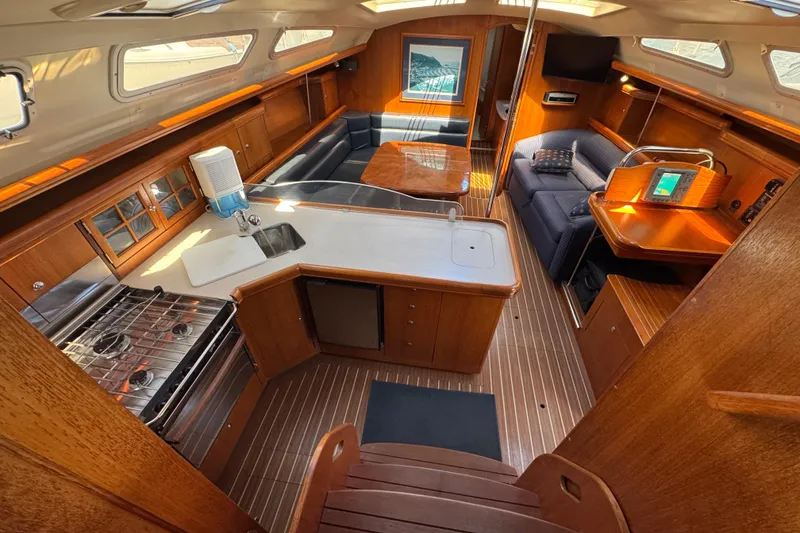 Slide: The Image of Interior of 2004 Hunter 41 Aft Cockpit yacht with wood finish and modern amenities. - 24