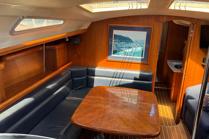 Slide: The Image of Interior of 2004 Hunter 41 Aft Cockpit yacht with wood finish and seating area. - 25