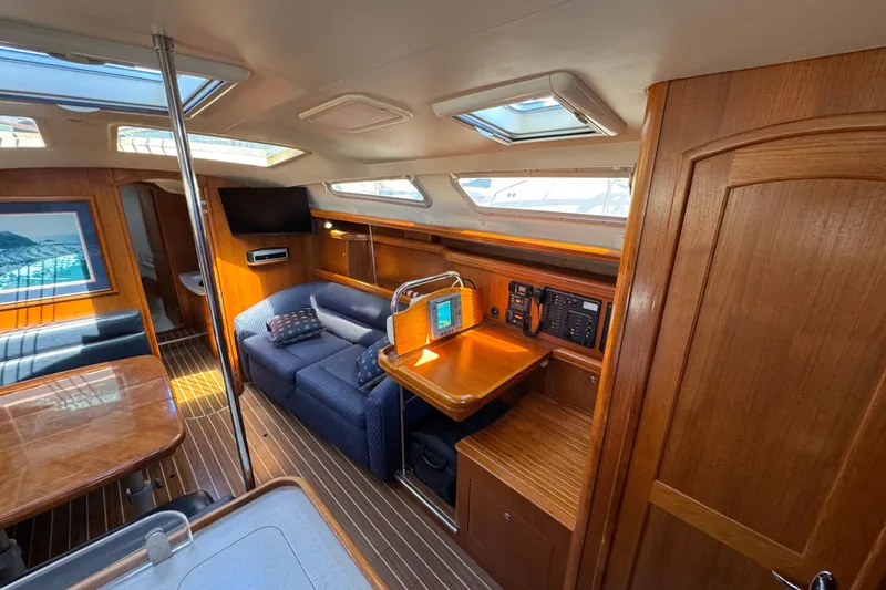 Slide: The Image of Interior of 2004 Hunter 41 Aft Cockpit yacht with wood finish and seating area. - 27