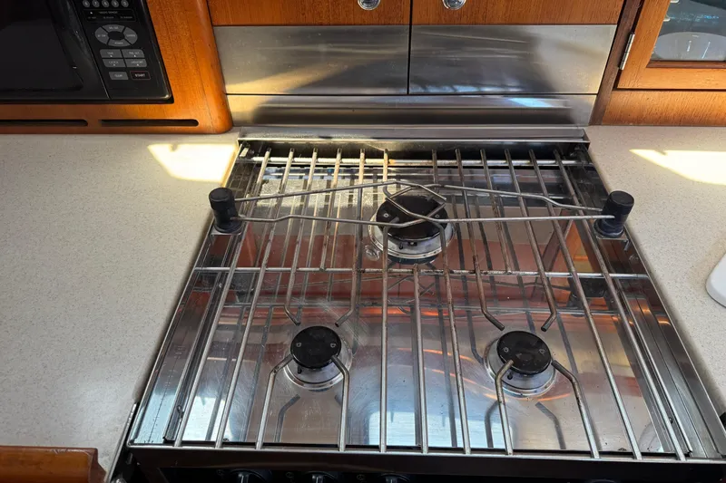 Slide: The Image of Stainless steel stove in 2004 Hunter 41 Aft Cockpit yacht kitchen. - 30