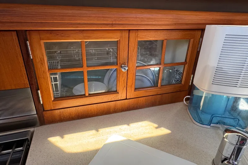 Slide: The Image of Wooden cabinet with glass doors in 2004 Hunter 41 Aft Cockpit yacht kitchen. - 35