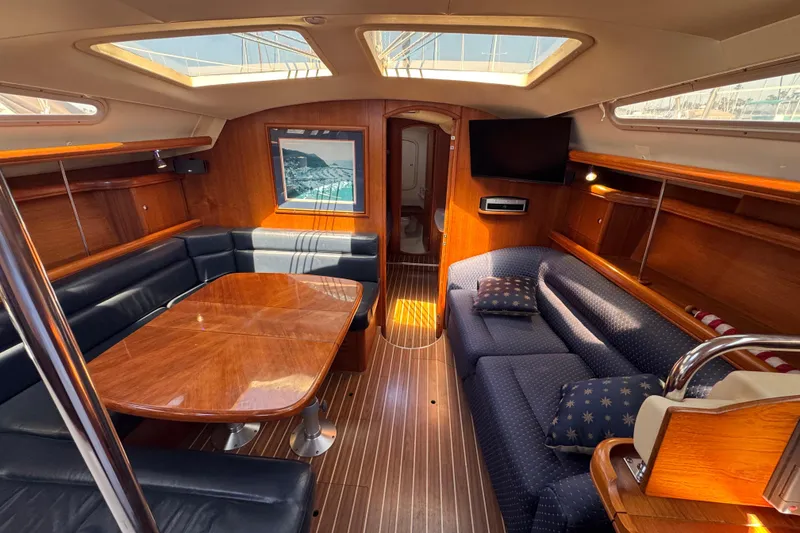 Slide: The Image of Luxurious interior of 2004 Hunter 41 Aft Cockpit yacht with elegant wood finish. - 40