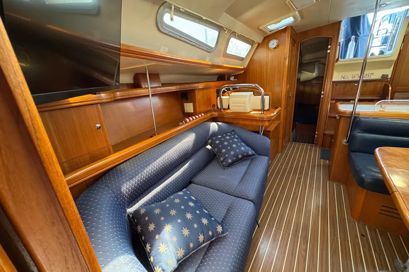 Slide: The Image of Luxurious interior of 2004 Hunter 41 Aft Cockpit yacht with elegant wood finish. - 53