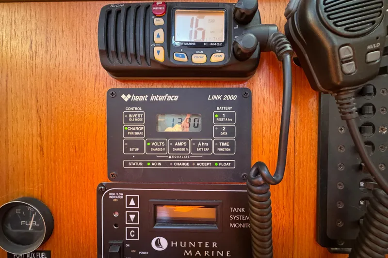 Slide: The Image of Control panel of a 2004 Hunter 41 Aft Cockpit sailboat with communication equipment. - 59