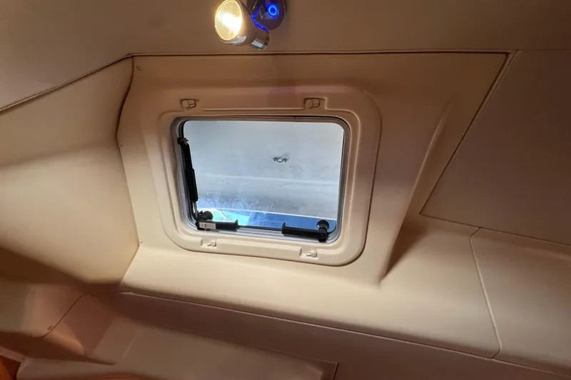 Slide: The Image of Interior view of a 2004 Hunter 41 Aft Cockpit yacht window with overhead light. - 67