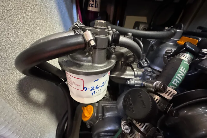 Slide: The Image of Fuel filter system in a 2004 Hunter 41 Aft Cockpit sailboat engine compartment. - 75