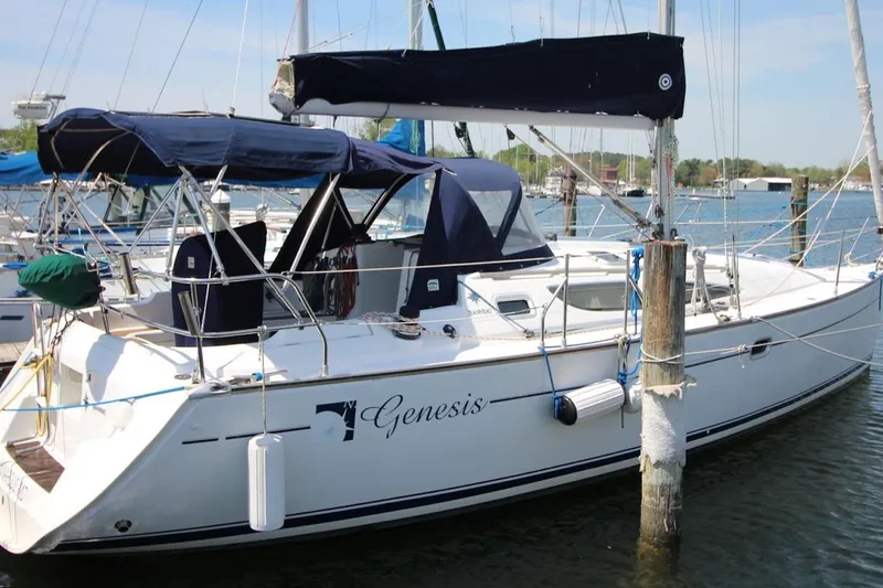 The Image of 2004 Jeanneau Sun Odyssey 35 sailboat named Genesis docked at a marina. - 1