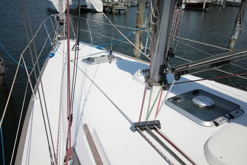 Slide: The Image of Deck view of 2004 Jeanneau Sun Odyssey 35 sailboat in marina. - 10