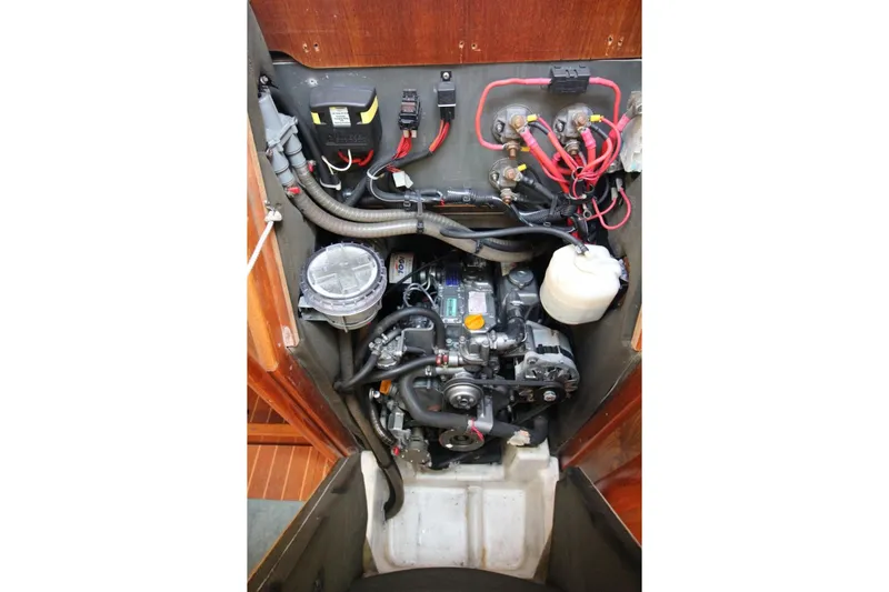 Slide: The Image of Engine compartment of a 2004 Jeanneau Sun Odyssey 35 sailboat, showcasing wiring and components. - 28