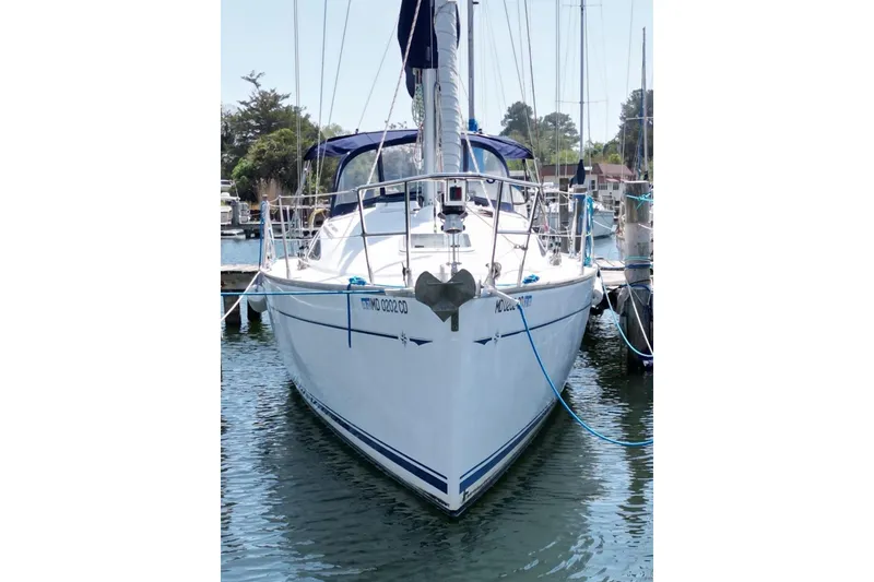 Slide: The Image of 2004 Jeanneau Sun Odyssey 35 sailboat docked in a marina. - 5