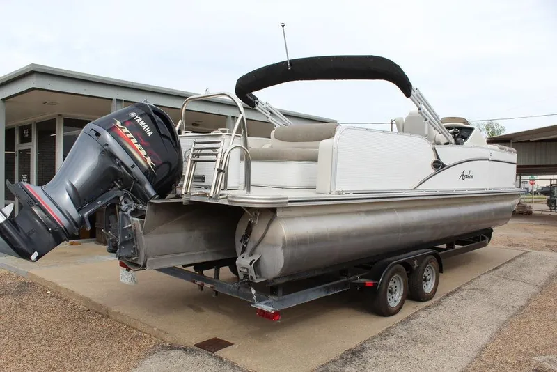 Slide: The Image of 2020 Avalon Catalina Versatile Rear Bench 23' pontoon boat with Yamaha outboard motor on trailer. - 13