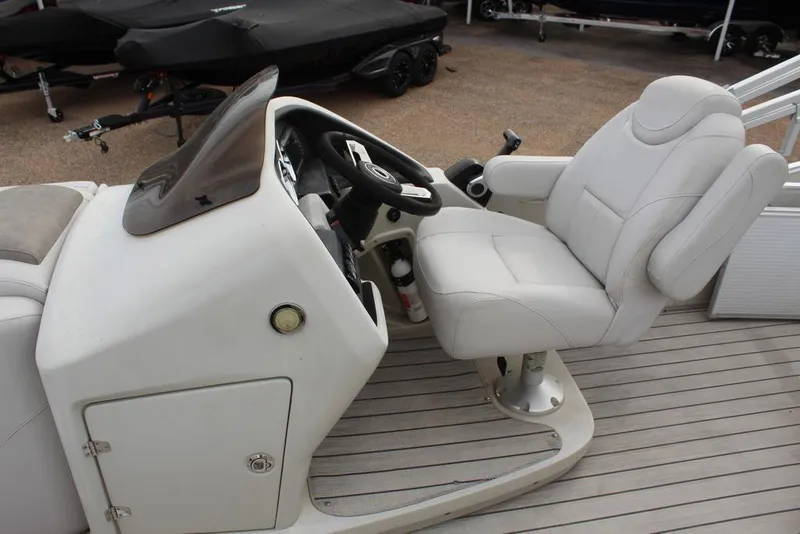 Slide: The Image of 2020 Avalon Catalina Versatile Rear Bench 23' boat helm with white captain's chair. - 14