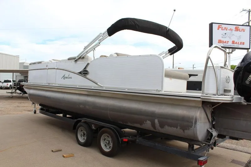Slide: The Image of 2020 Avalon Catalina Versatile Rear Bench 23' pontoon boat on trailer at dealership. - 18