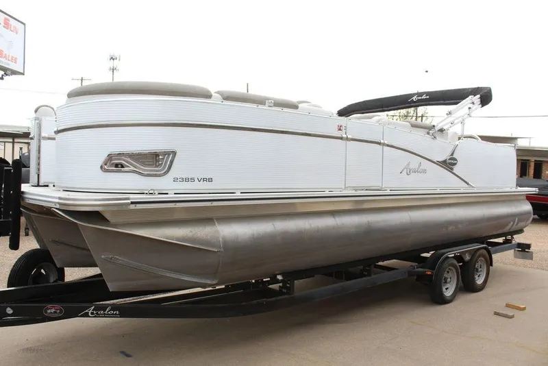 Slide: The Image of 2020 Avalon Catalina Versatile Rear Bench 23' pontoon boat on trailer. - 19