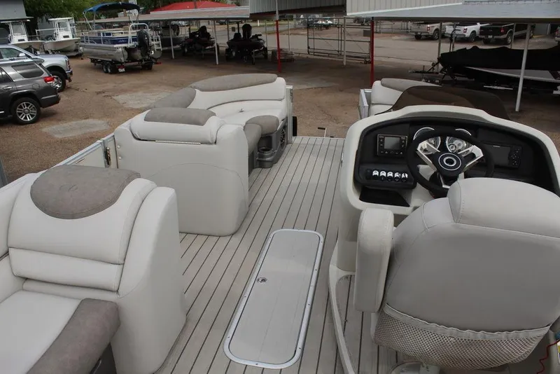 Slide: The Image of 2020 Avalon Catalina Versatile Rear Bench 23' boat interior with helm and seating. - 26