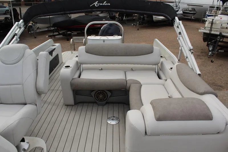 Slide: The Image of 2020 Avalon Catalina Versatile Rear Bench 23' boat interior with plush seating. - 4