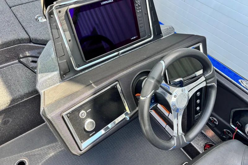 Slide: The Image of 2023 Ranger Z520R Cup-Equipped boat dashboard with steering wheel and Lowrance display. - 11