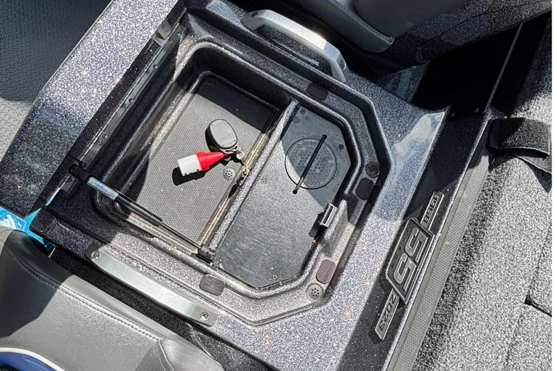 Slide: The Image of 2023 Ranger Z520R Cup-Equipped boat storage compartment with key and safety lanyard. - 14