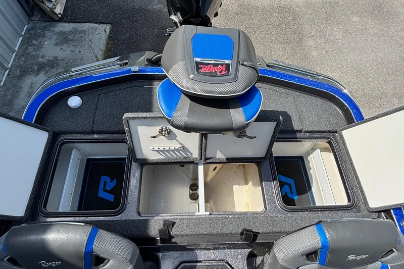 Slide: The Image of 2023 Ranger Z520R Cup-Equipped boat interior with storage compartments and seating. - 16