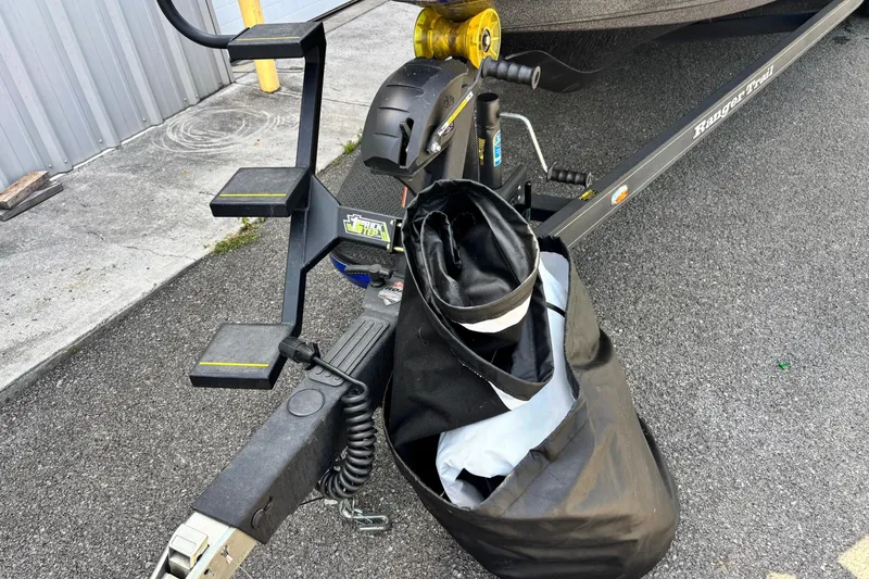 Slide: The Image of 2023 Ranger Z520R Cup-Equipped trailer with steps and storage bag on asphalt. - 3