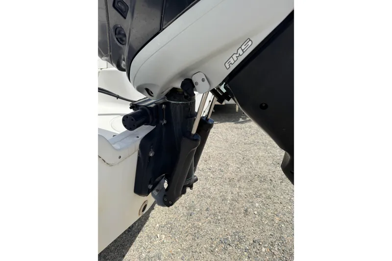 Slide: The Image of Close-up of a 2008 Triton 225 CC boat engine detail on a sunny day. - 11