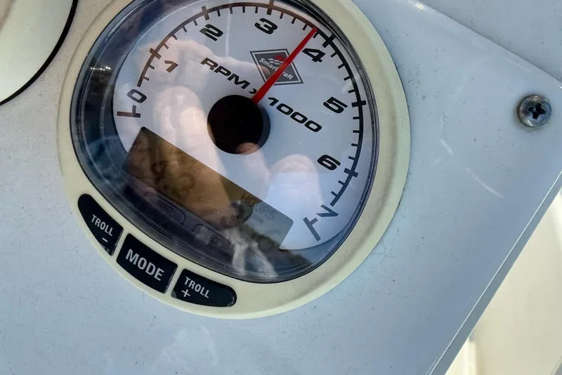 Slide: The Image of Triton 225 CC 2008 tachometer displaying RPM with troll mode buttons. - 13