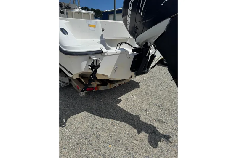 Slide: The Image of Rear view of a 2008 Triton 225 CC boat with an outboard motor. - 9