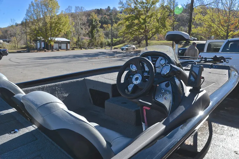 Slide: The Image of 2018 Bass Tracker Pro 19 boat interior with steering wheel and dashboard controls. - 19