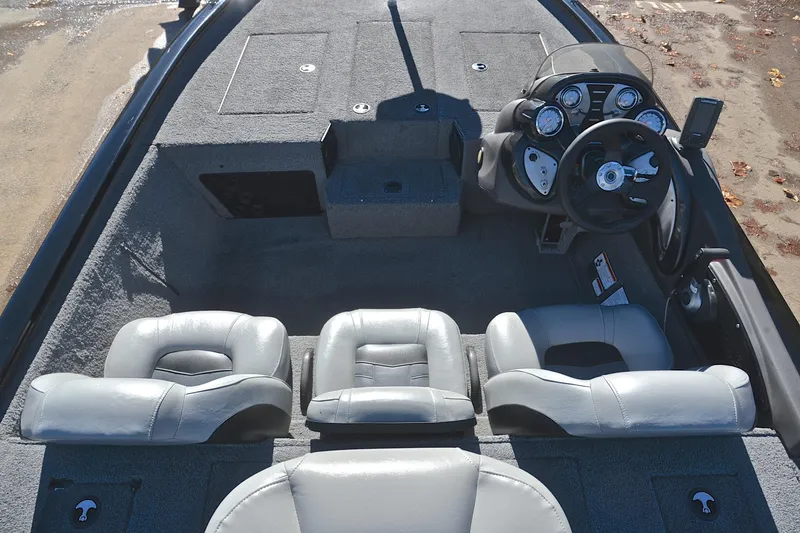 Slide: The Image of 2018 Bass Tracker Pro 19 boat interior with steering console and seating. - 20