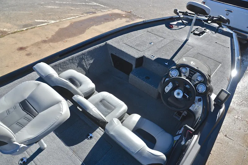 Slide: The Image of 2018 Bass Tracker Pro 19 boat interior with steering console and seating. - 21