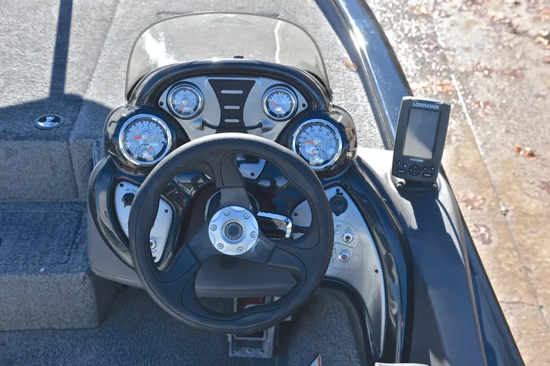 Slide: The Image of Bass Tracker Pro 19 boat dashboard with steering wheel and Lowrance fish finder, 2018 model. - 24