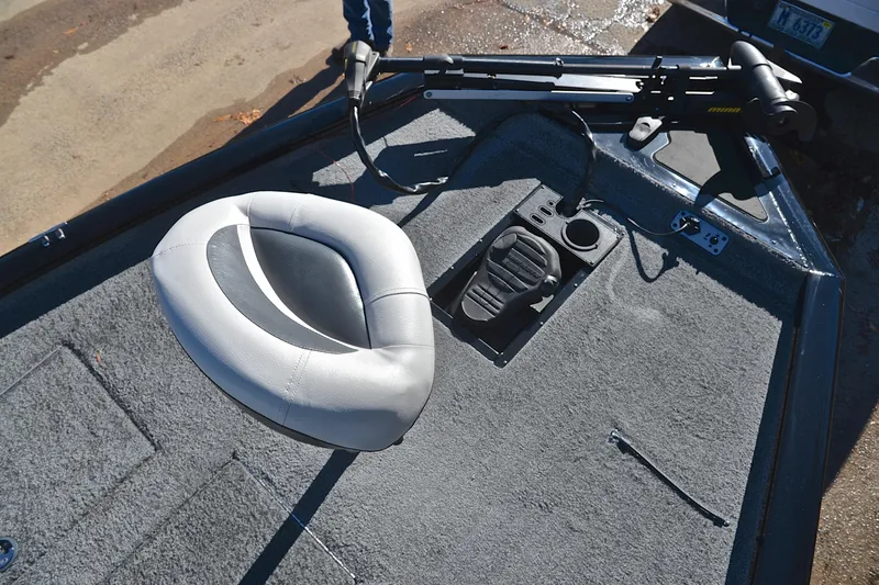 Slide: The Image of 2018 Bass Tracker Pro 19 boat interior with seat and control panel. - 25