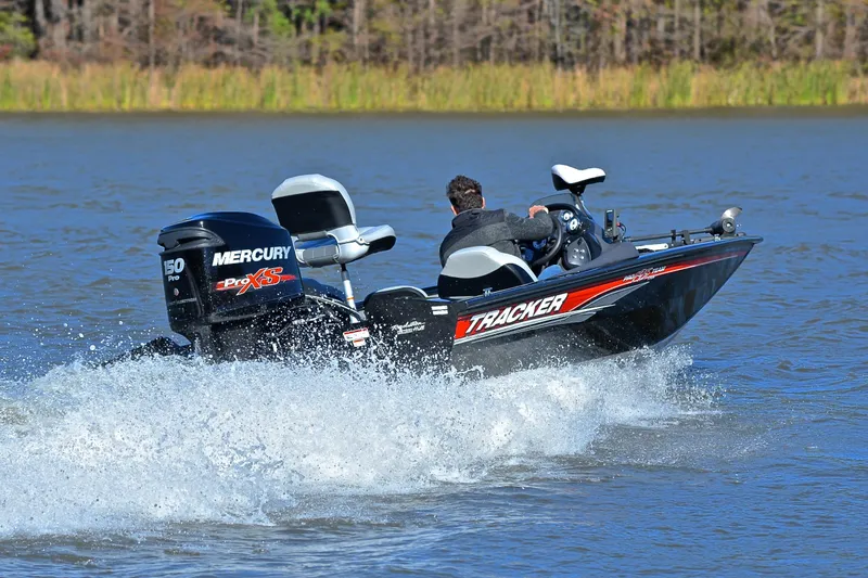 Slide: The Image of 2018 Bass Tracker Pro 19 boat speeding on a lake with Mercury Pro XS engine. - 5