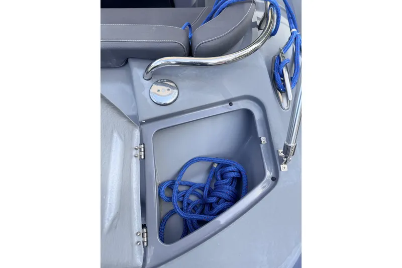 Slide: The Image of Storage compartment with blue rope on a 2020 Grand Inflatables G580 boat. - 18