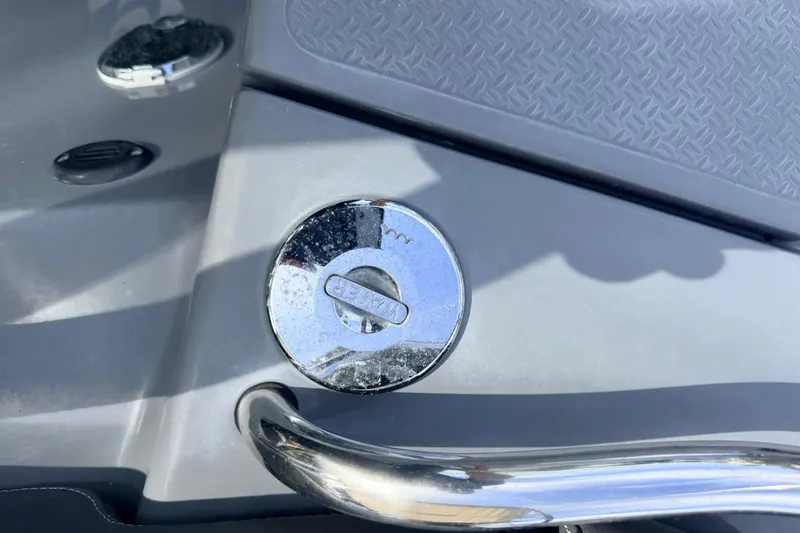 Slide: The Image of Fuel cap of a 2020 Grand Inflatables G580 boat, featuring a chrome finish. - 20