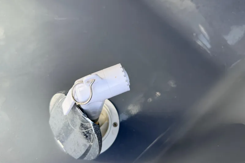 Slide: The Image of Close-up of a 2020 Grand Inflatables G580 valve component on a gray surface. - 21