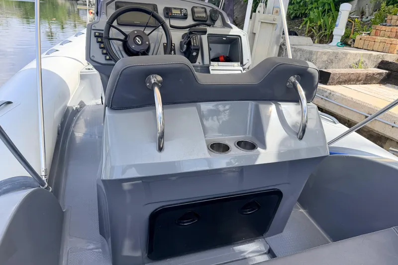 Slide: The Image of 2020 Grand Inflatables G580 boat interior with steering wheel and control panel. - 23