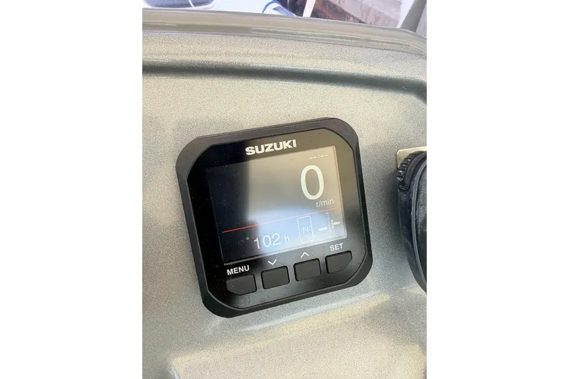 Slide: The Image of Suzuki digital display on 2020 Grand Inflatables G580 boat dashboard. - 24